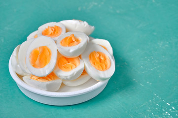 Sliced hard boiled eggs on color background  Nutrition concept