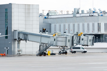 Two telescopic telescopes for boarding passengers on the plane, empty parking.