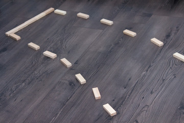 Wooden block road on the dark wooden background. Dead end road.