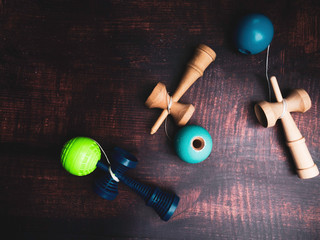 Traditional Japanese wood toy Kendama on wooden background, Symbol of Japanese boy toy.