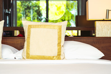 Beautiful comfortable pillow on bed decoration in bedroom