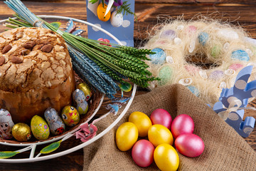 Easter cake and colorful eggs on festive Easter table