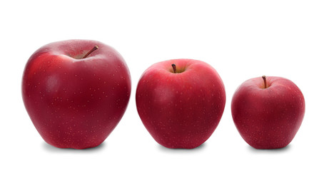 Big, middle and small fresh red apples in a row isolated on white background. Three different sized apples.