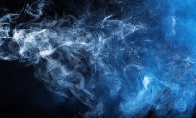 Blue smoke over black studio background