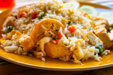 Authentic cuisine pad thai with rice smoked tofu bean sprouts peanuts and lime garnish