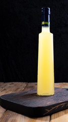 Limoncello in a bottle with space for labels and text. Traditional Italian lemon liqueur. Alcohol...