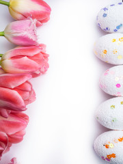 easter decorative color eggs on white background. Top view