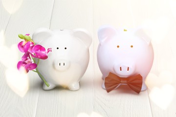 White and blue piggy banks on table on background