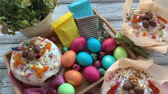 Sweet, Easter table, Easter cupcakes in icing, with multi-colored sprinkles, painted chicken and quail eggs.