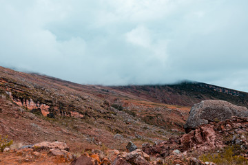 Landscape in Bolivia formed by mountains and white clouds
