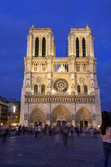 Fototapeta na wymiar Notre Dame cathedral front in the early evening blue hours, Paris, France