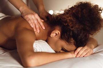 Woman enjoying therapeutic neck massage in spa - obrazy, fototapety, plakaty