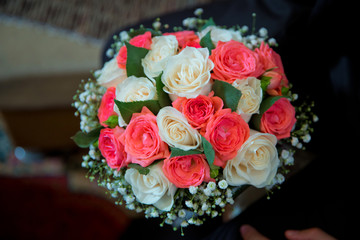 Wedding bouquet of white and red roses . bridal bouquet bride and groom on the Azerbaijan wedding . beautiful bouquet of tender and colorful flowers .