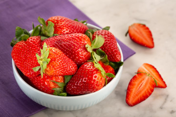 Fresh strawberries in ceramic bowl
