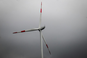 Wind generator turbine or windmill or wind farm, cloudy foggy day
