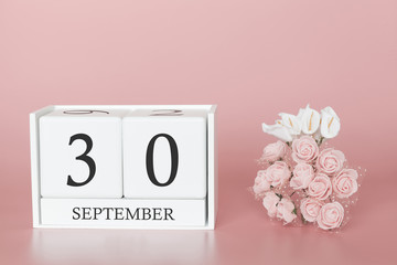 September 30th. Day 30 of month. Calendar cube on modern pink background, concept of bussines and an importent event.