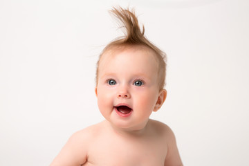 portrait of baby girl smiling 6 months on white background,6 month child baby girl lying happy smiling on a white background