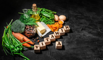 Natural products rich in vitamin A as parsley leaves, dried apricots, carrots, broccoli, butter,...