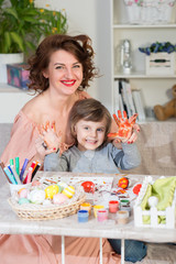 Preparations for Easter celebration with painting eggs and entertaining with family