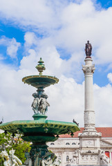 Fototapeta na wymiar The Dom Pedro IV Monument and fountain, Rossio Square, Lisbon, Portugal