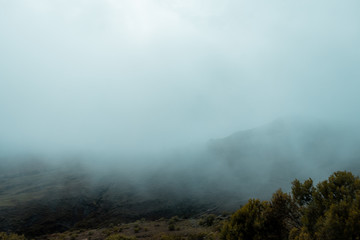 Landscape in Bolivia formed by mountains and white clouds