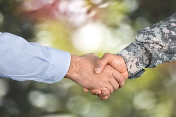 Business Agreement Handshake on background, close up