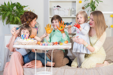 Preparations for Easter celebration with painting eggs and entertaining with family