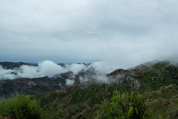 Landscape in Bolivia formed by mountains and white clouds