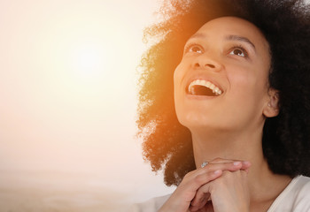 Sunlight on Young Prayer Woman face. Faith, Happiness , Gratitude to God expression