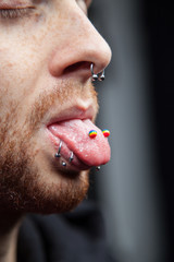 Bearded Man with Tongue (Venom) and Nose (Septum) Piercings