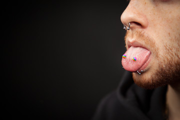 Bearded Man with Tongue (Venom) and Nose (Septum) Piercings
