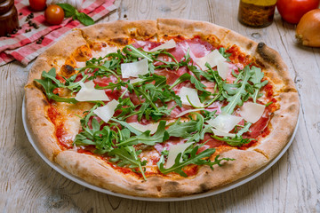 Pizza with Parma ham and arugula