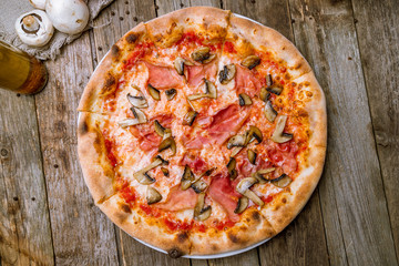 Pizza with ham and mushrooms