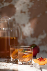 Ice tea and nectarine. Jag, two glasses.  A refreshing summer drink