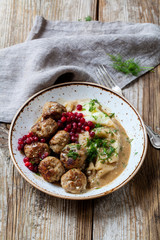 Scandinavian meatballs with mash potatoes and lingonberries
