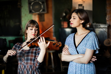 young woman having a violin lesson