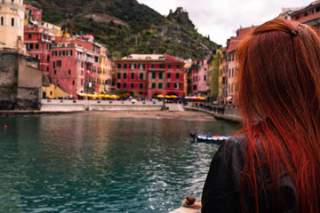 Fototapeta na wymiar Girl is looking the awesome village of Vernazza, Cinque Terre, Liguria, Italy 