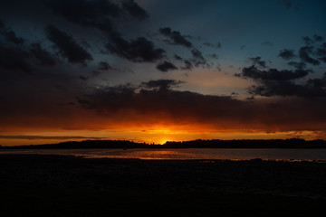dark red sunset over sea in evening