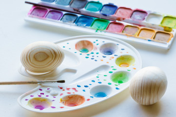 Obraz na płótnie Canvas Clean eggs with paints on background