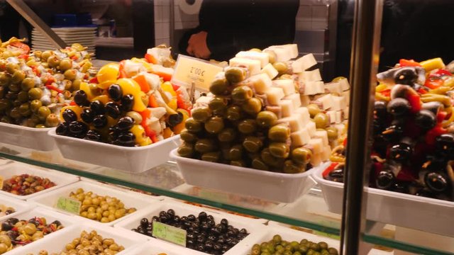 MADRID SPAIN Various delicacies and tasty dishes layout showcase in San Miguel market touristic city center