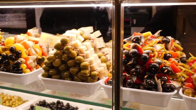 MADRID SPAIN Various delicacies and tasty dishes layout showcase in San Miguel market touristic city center