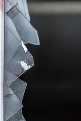 Broken window. Sharp protruding glass fragments.