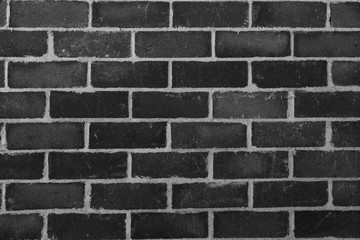 Grey, black and white brick wall texture. It can be used as a background