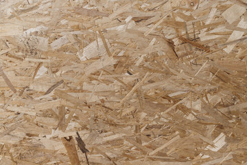 Pressed and glued wood chips. Plywood board Abstract background. Texture of plywood from large wood...