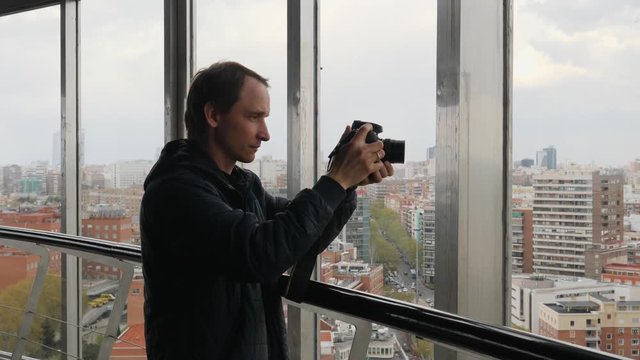 MADRID SPAIN People visitors in observation deck Moncloa tower taking pictures of city view vie phones and photo cameras