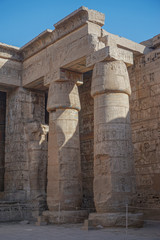 Luxor, Egypt: Corner of the peristyle courtyard at Medinet Habu, New Kingdom mortuary temple of Ramesses III on the West Bank of the Nile River.
