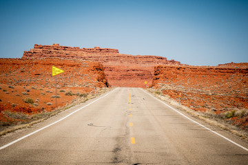 Fototapeta na wymiar Endless road in the desert of Utah - travel photography