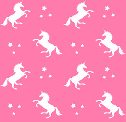 Fototapeta premium Vector seamless pattern of white unicorn silhouette isolated on pink background