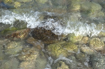 Fototapeta na wymiar Large sea stones in sea water close-up