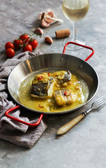 bacalao al pil pil, salted cod in emulsified olive oil sauce, spanish cuisine, basque country